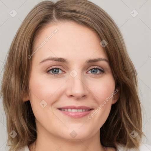 Joyful white young-adult female with medium  brown hair and green eyes