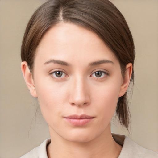 Neutral white young-adult female with medium  brown hair and brown eyes