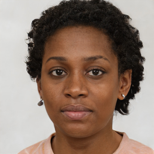 Neutral black young-adult female with short  brown hair and brown eyes