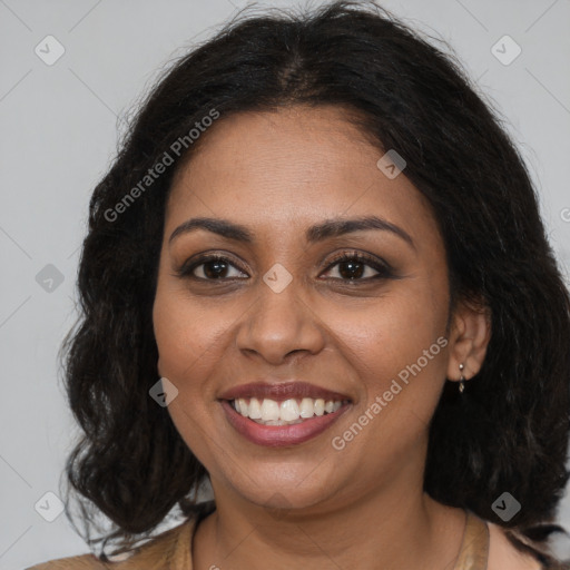 Joyful black young-adult female with long  brown hair and brown eyes