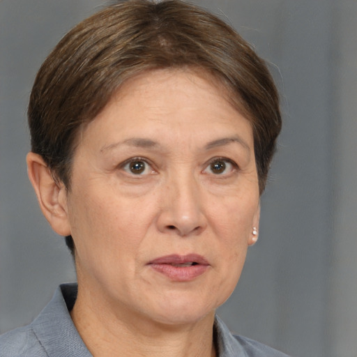 Joyful white adult female with short  brown hair and brown eyes