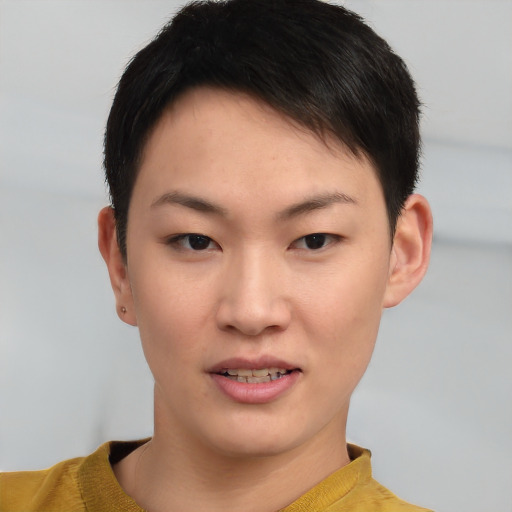 Joyful asian young-adult female with short  brown hair and brown eyes