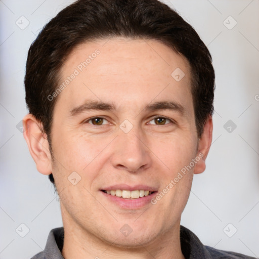 Joyful white adult male with short  brown hair and grey eyes