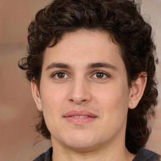 Joyful white young-adult male with medium  brown hair and brown eyes