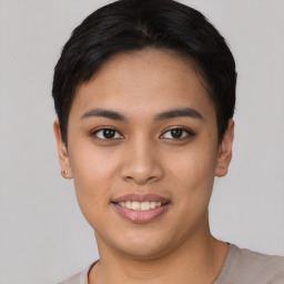 Joyful asian young-adult female with short  black hair and brown eyes