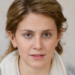 Joyful white young-adult female with medium  brown hair and blue eyes