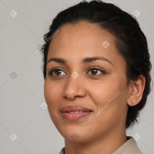 Joyful latino young-adult female with medium  brown hair and brown eyes