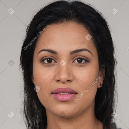 Joyful latino young-adult female with long  brown hair and brown eyes