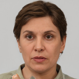 Joyful white adult female with short  brown hair and grey eyes