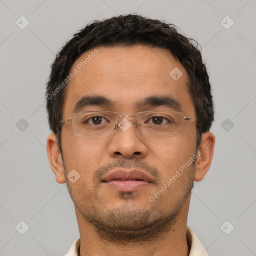 Neutral latino young-adult male with short  black hair and brown eyes