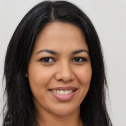 Joyful asian young-adult female with long  brown hair and brown eyes