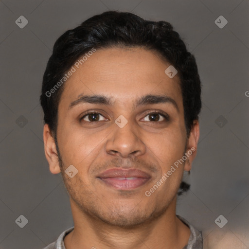 Joyful latino young-adult male with short  brown hair and brown eyes