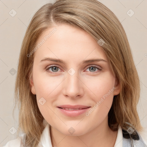 Joyful white young-adult female with medium  brown hair and blue eyes