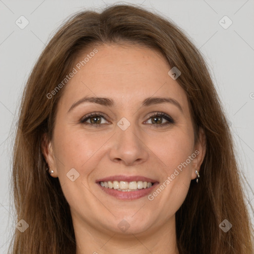 Joyful white adult female with long  brown hair and brown eyes