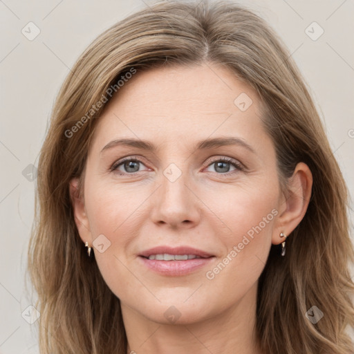 Joyful white adult female with medium  brown hair and grey eyes