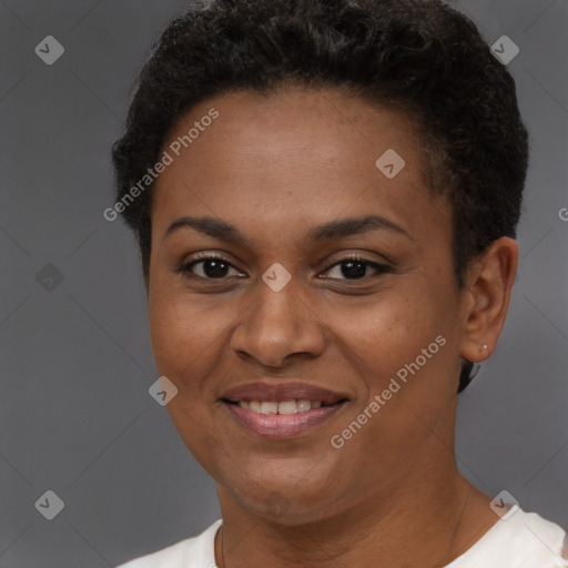 Joyful black adult female with short  brown hair and brown eyes