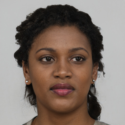 Neutral black young-adult female with short  black hair and brown eyes