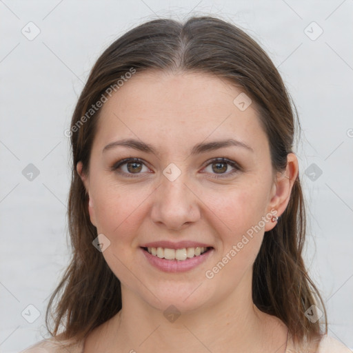 Joyful white young-adult female with medium  brown hair and grey eyes