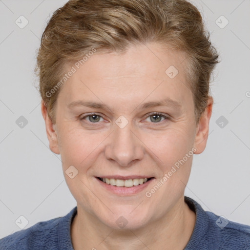 Joyful white adult female with short  brown hair and grey eyes