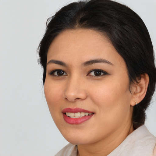 Joyful asian young-adult female with medium  brown hair and brown eyes