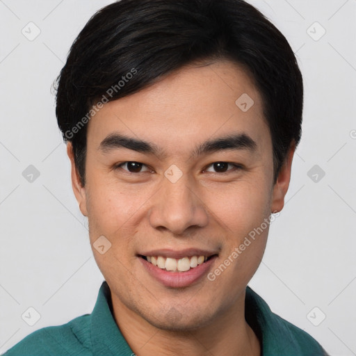 Joyful white young-adult male with short  black hair and brown eyes