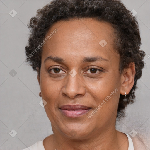 Joyful black adult female with short  brown hair and brown eyes