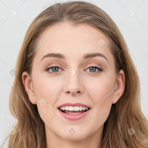 Joyful white young-adult female with long  brown hair and grey eyes