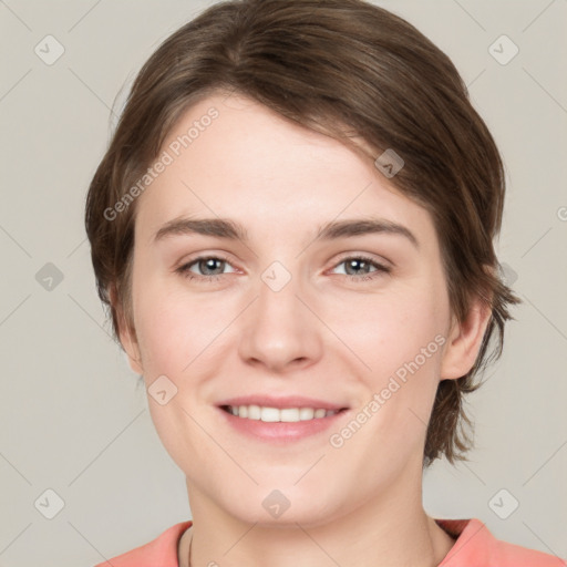 Joyful white young-adult female with medium  brown hair and grey eyes