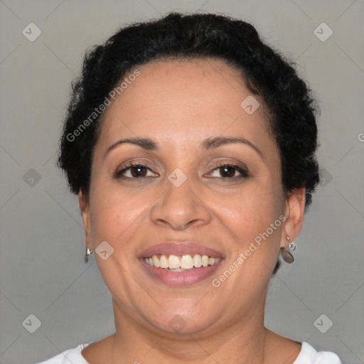 Joyful black adult female with short  brown hair and brown eyes