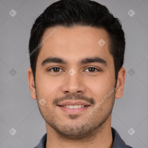 Joyful white young-adult male with short  black hair and brown eyes