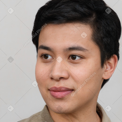 Joyful white young-adult male with short  black hair and brown eyes