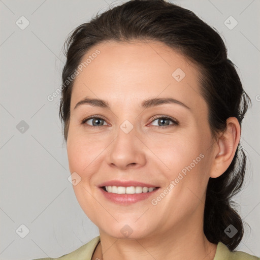 Joyful white young-adult female with medium  brown hair and brown eyes