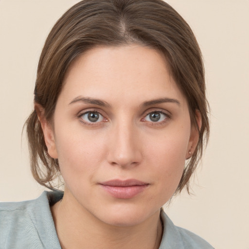 Neutral white young-adult female with medium  brown hair and grey eyes