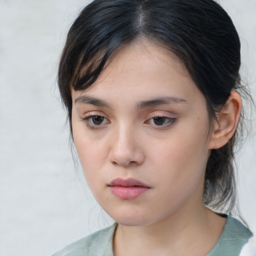 Neutral asian young-adult female with medium  brown hair and brown eyes