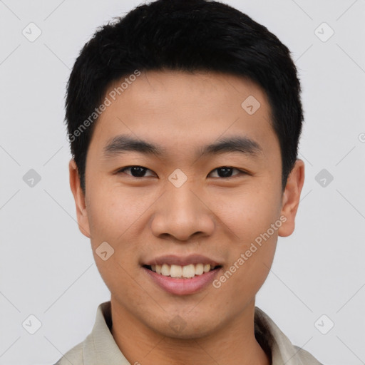 Joyful asian young-adult male with short  black hair and brown eyes