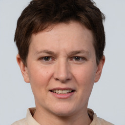 Joyful white adult female with short  brown hair and brown eyes