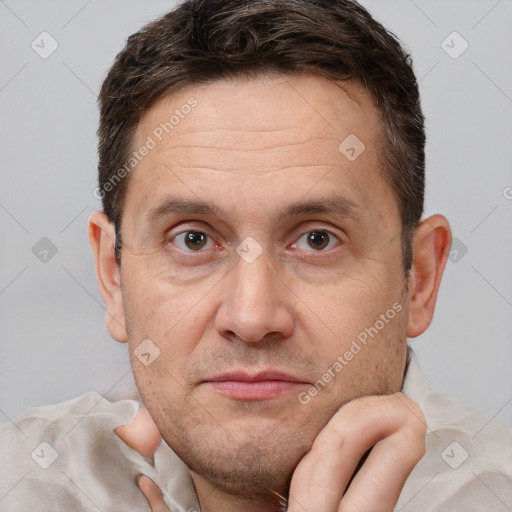 Joyful white adult male with short  brown hair and brown eyes