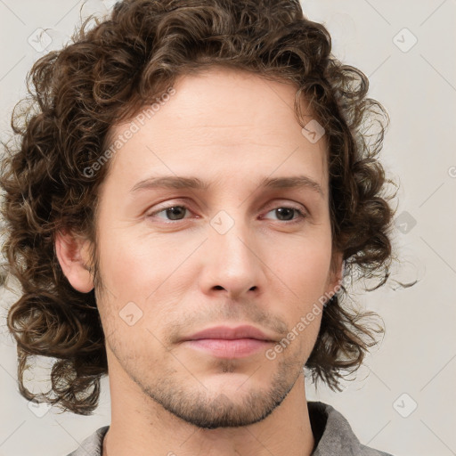 Neutral white young-adult male with medium  brown hair and brown eyes