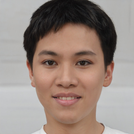 Joyful asian young-adult male with short  brown hair and brown eyes
