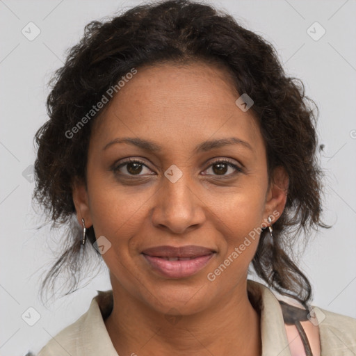 Joyful black adult female with medium  brown hair and brown eyes