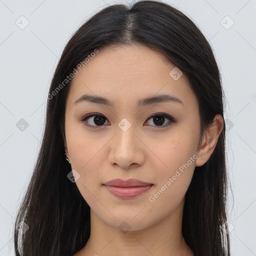 Joyful asian young-adult female with long  brown hair and brown eyes