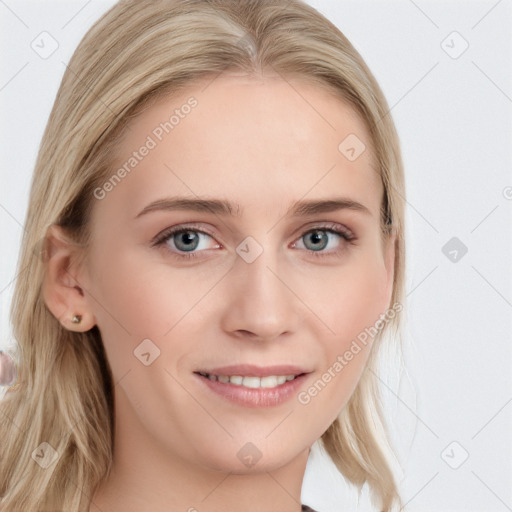 Joyful white young-adult female with long  brown hair and blue eyes