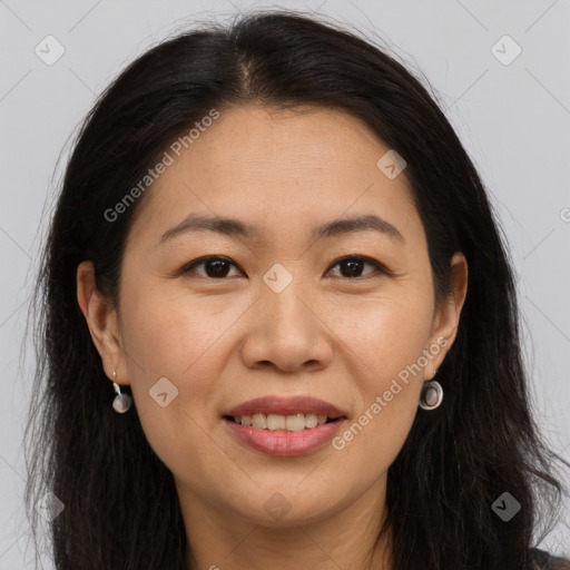 Joyful white adult female with long  brown hair and brown eyes