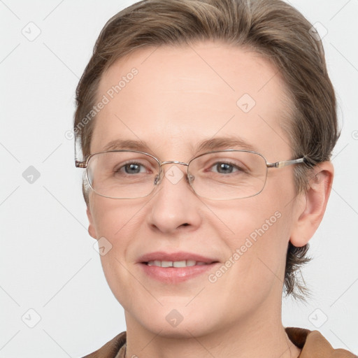 Joyful white adult female with medium  brown hair and blue eyes