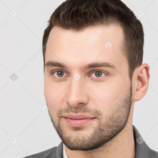 Joyful white young-adult male with short  brown hair and brown eyes