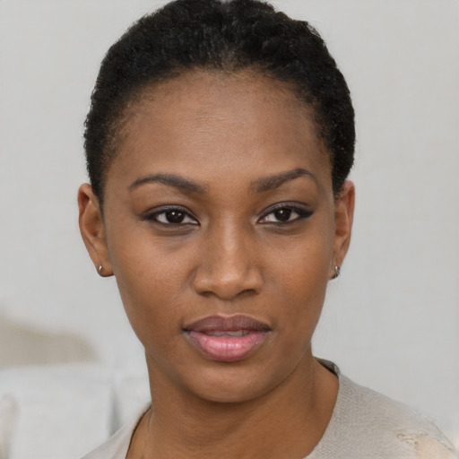 Joyful latino young-adult female with short  black hair and brown eyes
