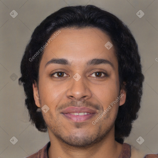 Joyful latino young-adult male with short  brown hair and brown eyes