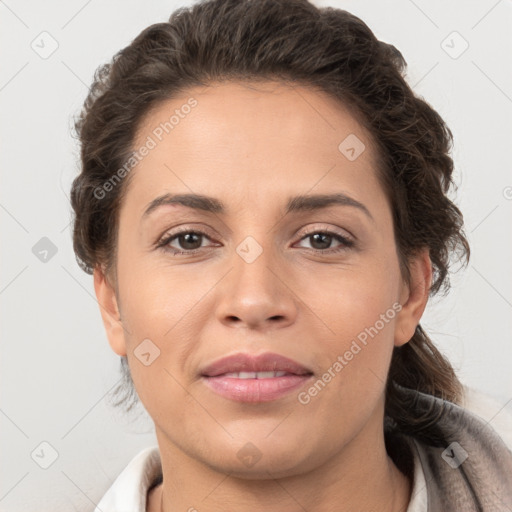 Joyful white adult female with short  brown hair and brown eyes