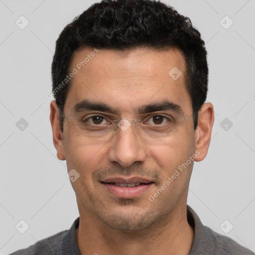 Joyful white young-adult male with short  black hair and brown eyes