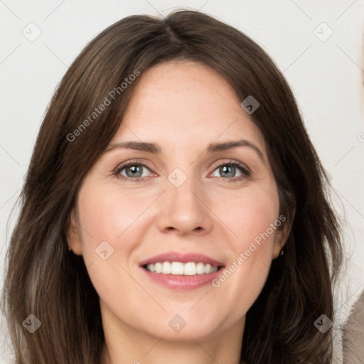 Joyful white young-adult female with long  brown hair and green eyes